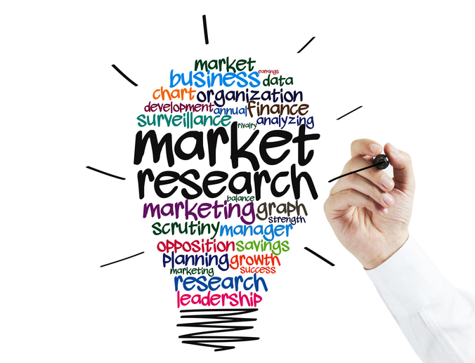 Businessman writing on screen a Market Research idea Bulb